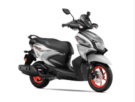 Yamaha scooter with silver body, black seat, and bright red rims, showcasing a compact sporty design and modern styling attributes